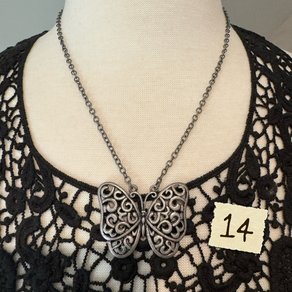 Metal butterfly necklace.